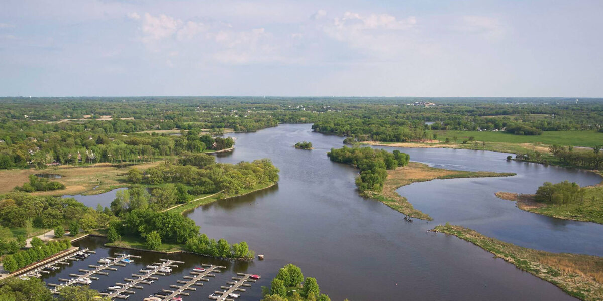 Ariel view of river with small boat docks