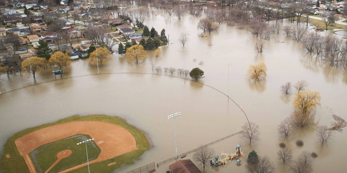 Flooded park with baseball diamond just above water
